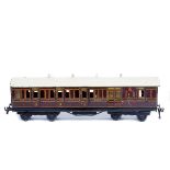 A Bing for Bassett-Lowke Gauge One tinplate LMS bogie coach. Brake third, in lined maroon livery.