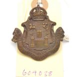 An OR’s pale bronze cap badge of Dublin University OTC, and similar large button. GC Plate 4