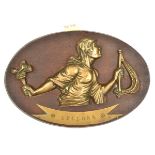 A cast brass badge of HMS Bellona, cruiser 1909-21, showing the Roman goddess of War, head (