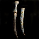 An Ottoman Turkish dagger jambiya. 19th century, curved DE wavy blade 31cms, with raised central