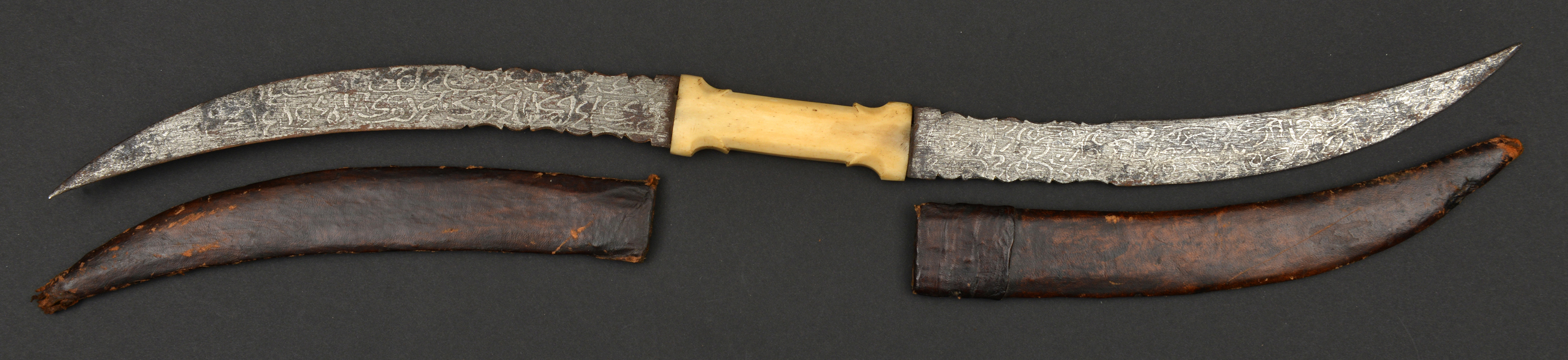 An African (Sudanese) double dagger haladie. c.1900, curved DE blades 28cms each etched with thuluth