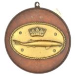 A cast brass oval badge of HMS Sturgeon, destroyer 1917-26, showing a sturgeon with coronet above,