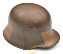 A German M18 steel helmet, with typical painted camouflage finish and leather liner. QGC (finish