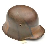 A German M18 steel helmet, with typical painted camouflage finish and leather liner. QGC (finish