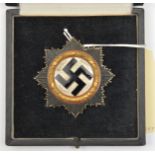A Third Reich German Cross in gold, of four hollow rivet construction with maker’s mark “134” in