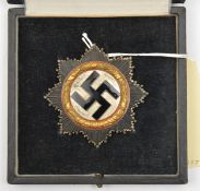 A Third Reich German Cross in gold, of four hollow rivet construction with maker’s mark “134” in