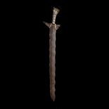 A Sulu datu's short sword kris from the Philippines. 19th century, broad wavy blade 52cms, silver/