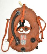 A WWII inflatable life jacket, with fastening straps, attachments, inflation tube and “Auxiliary