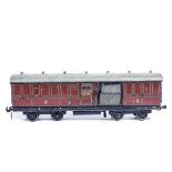 A Carette Gauge One tinplate LMS mail van in lined maroon livery. AF-QGC, some chipping and