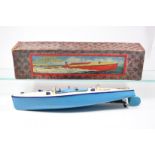 A Hornby Meccano Speed Boat (3). Racer III, in cream and blue. Boxed, some damage and splits to lid.