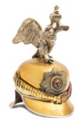 An Imperial Russian Garde officer’s helmet, with brass skull and chinscales, star plate with gilt