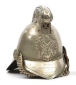 A fire officer’s presentation WM Merryweather pattern helmet, with front peak and large back peak,