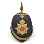 A post-1902 officer’s blue cloth spiked helmet of The Queen’s (Royal West Surrey Regiment), brass