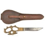 A WWII Middle East pattern Commando knuckle knife, single edged blade 6" into heavy brass “