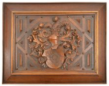 A 19th century German deed (?) box with deeply carved mahogany armorial lid, panelled and bearing