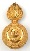 A Victorian officer’s gilt grenade badge for fur cap of the 102nd (Royal Madras Fusiliers),”102”