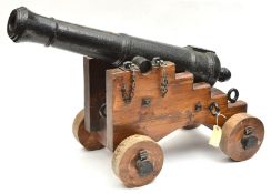 A good ship’s small cannon, c 1800, 32” iron barrel, mounted on a well made naval pattern timber