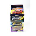 4 2000's issue Scalextric slot racing cars. Renault Magan (C2010) in silver/yellow livery, RN20, a