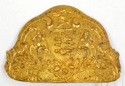 A die-struck gilt brass centre from a rayed helmet plate, c 1840, of the Madras Horse Artillery,