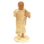 A well carved 19th century Japanese bone figure of a Samurai warrior, made in parts and assembled