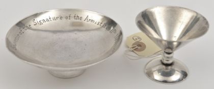 A Third Reich silver coloured schnapps cup, stamped with Luftwaffe eagle over “Celle”, the base
