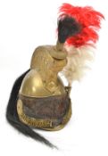 A mid 19th century French cavalry trooper’s brass helmet, edge binding to front and back peaks,