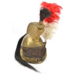 A mid 19th century French cavalry trooper’s brass helmet, edge binding to front and back peaks,