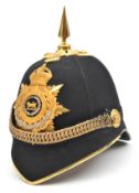 A post-1902 officer’s blue cloth spiked helmet of The Hampshire Regiment, gilt peak binding, top