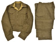 A good WWII Canadian “Battle Dress Blouse Serge”, with stamps, d 1943, and pair matching overalls, d