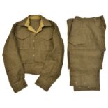 A good WWII Canadian “Battle Dress Blouse Serge”, with stamps, d 1943, and pair matching overalls, d