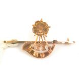 A 9ct gold sweetheart tie pin of the 6th Bn The King’s (Liverpool Regt), a bugle surmounted by the