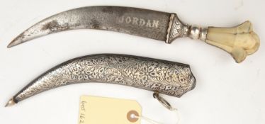 A Jordanian jambiya, blade 6½” with artificial etched “watering” and silver inlaid “Jordan”, the