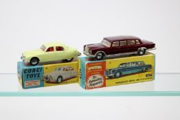2 Corgi Toys. Jaguar 2.4 litre saloon (208S). In lemon yellow with red interior. Together with a