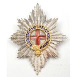 An officer’s gilt and silver plated puggaree badge of the Coldstream Guards, red and blue enamel