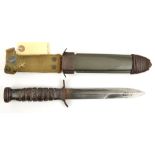 A WWII US M3 trench knife, blade 8¾”, DE at point, marked in capitals along one edge “US M3” and