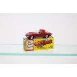 Corgi Toys 'E' Type Jaguar with Detachable Hard Top (307). Example in maroon with brown interior,