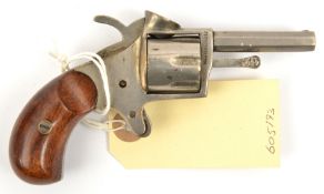 A cigar cutter in the form of a miniature revolver, 4½” overall, nickel plated overall, with spur