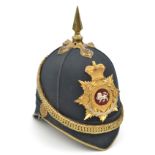 A Victorian officer’s blue cloth spiked helmet of The King’s Own (Royal Lancaster Regiment), brass