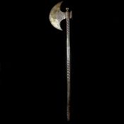 A Persian Qjar dynasty all iron axe. Crescent shaped head 19.5cms, chiselled with inscriptions and