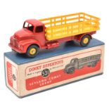 A Dinky Supertoys Leyland Comet Lorry (531). Example with red cab and chassis, yellow stake body and