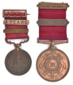 The Fire Brigades Association long service bronze medal, obv Victorian firefighter holding hose,