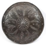 A circular embossed iron parade shield, in the style of the 16th century, with 5 knights and courtly