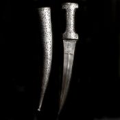 A Persian all-steel dagger khanjar. Late Qjar dynasty, curved DE blade 27cms cut with a pair of