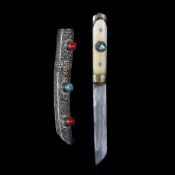 A good quality Tibetan knife. Second half of the 20th century, SE fullered blade 9cms, 2 piece