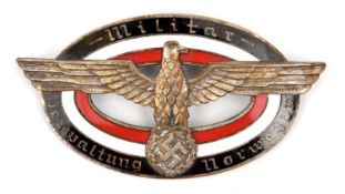 A Third Reich oval enamelled pin back badge for the German Administration in Norway, having an eagle