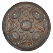 A Tibetan or North Indian border copper shield. 20th century, embossed with 4 seated buddha-like