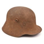 A German M16 steel helmet, with leather lining. QGC (externally rusted overall, the lining worn