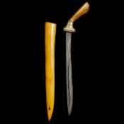 A Javanese dagger badek. Early 20th century, pattern welded single edge blade 30.5cms pierced
