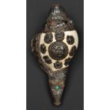 A silver mounted conch shell trumpet dung dkar. Tibet or China, 25cms, probably first half of the