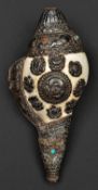 A silver mounted conch shell trumpet dung dkar. Tibet or China, 25cms, probably first half of the